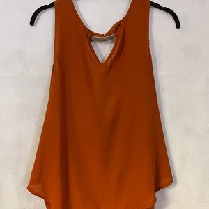 Orange blouse with gold detail